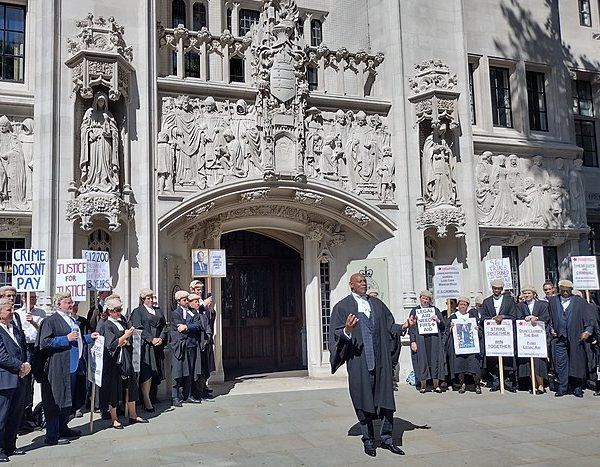 UK justice minister urged to raise solicitor pay or face judicial review challenge – JURIST